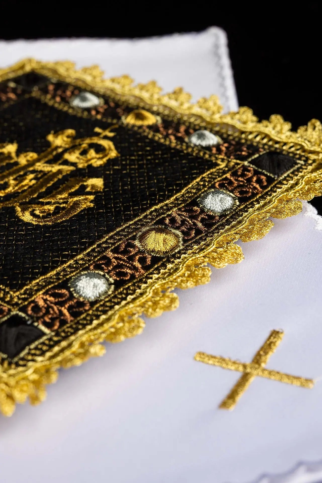 A black velvet chalice linens set with an embroidered IHS symbol