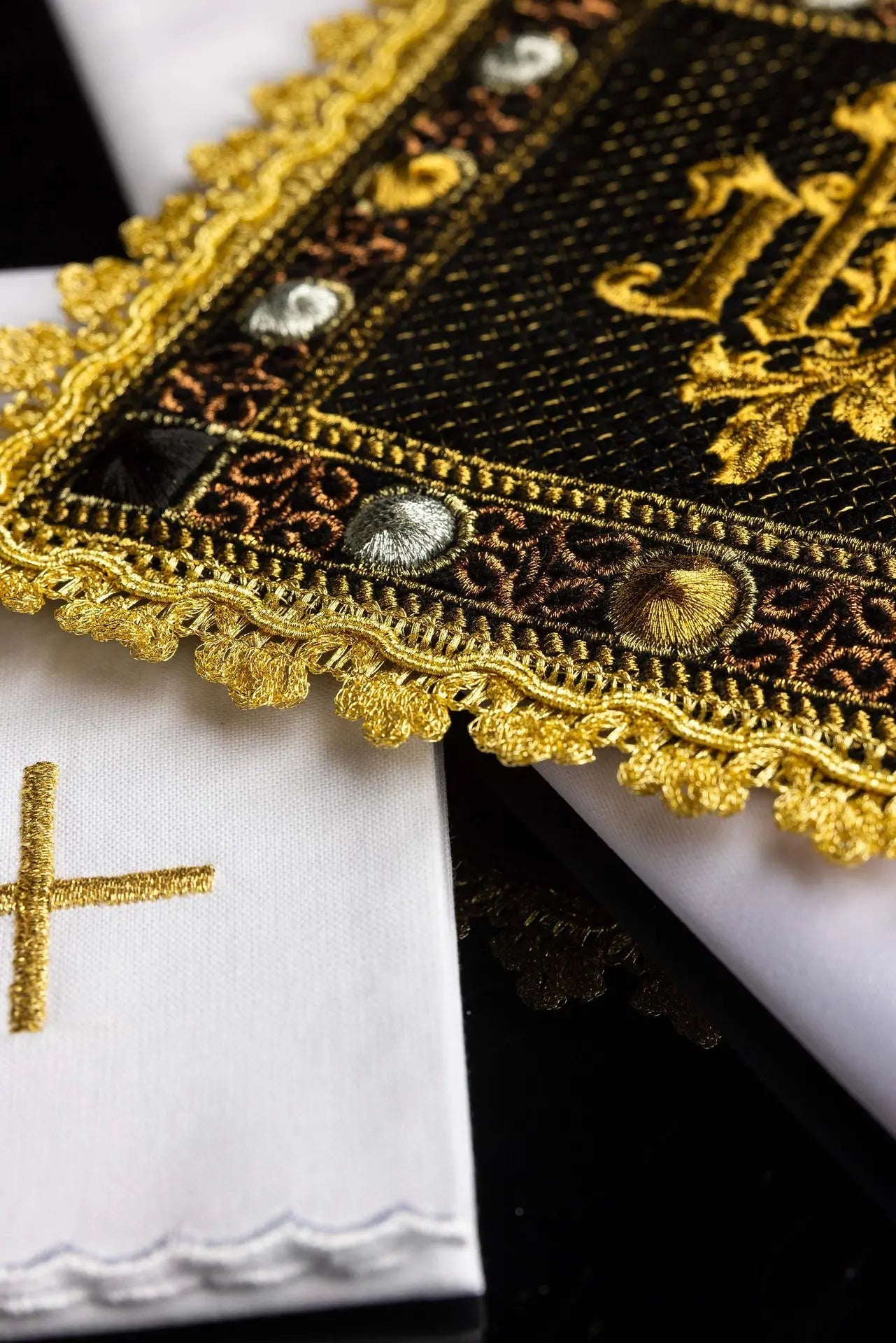 A black velvet chalice linens set with an embroidered IHS symbol