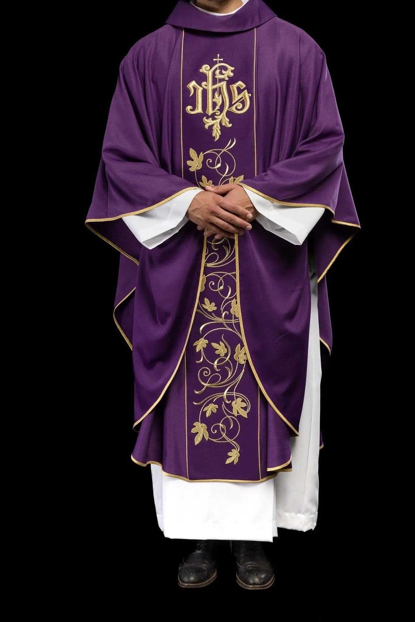 Purple liturgical chasuble with richly decorated belt with floral motif and IHS