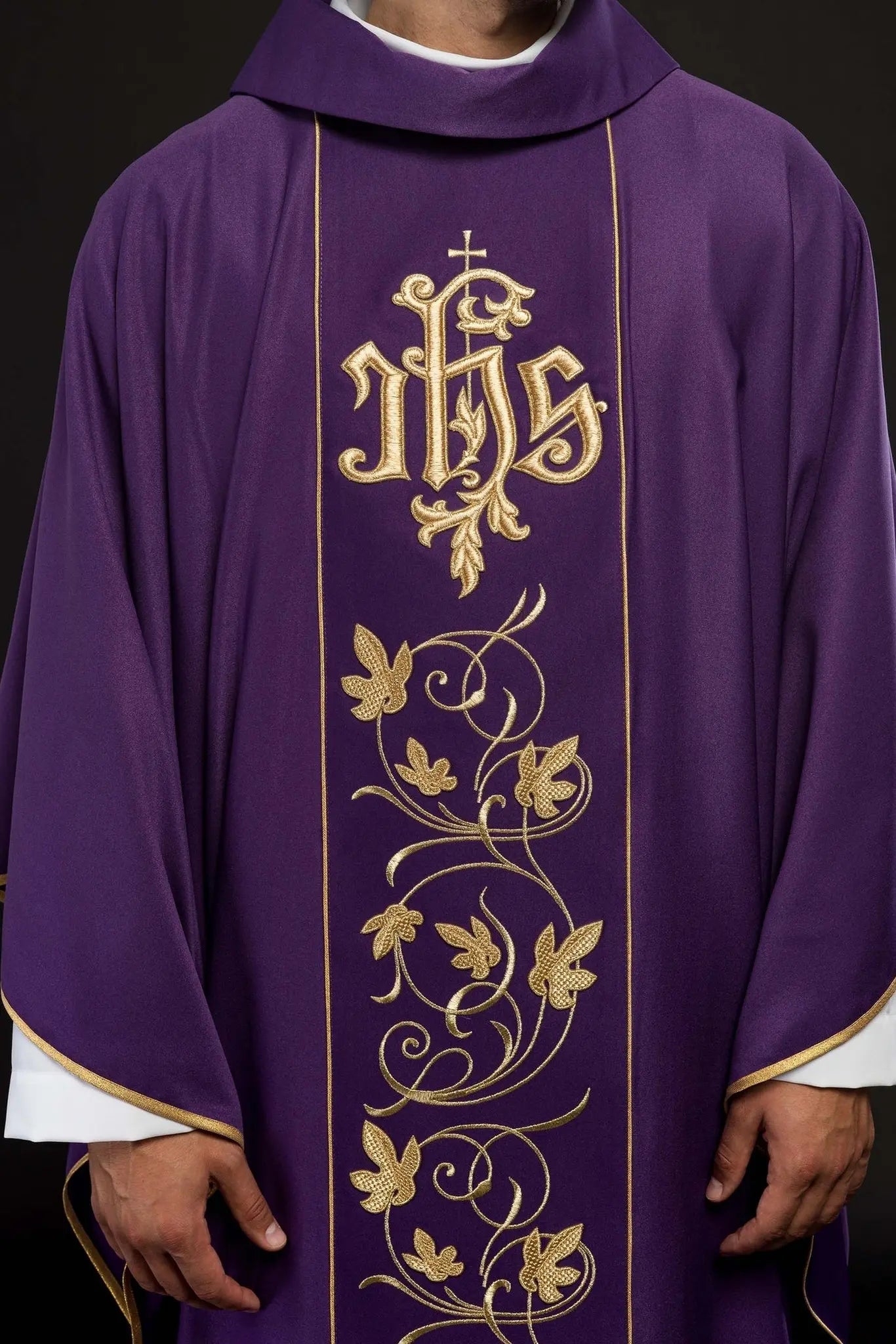 Purple liturgical chasuble with richly decorated belt with floral motif and IHS