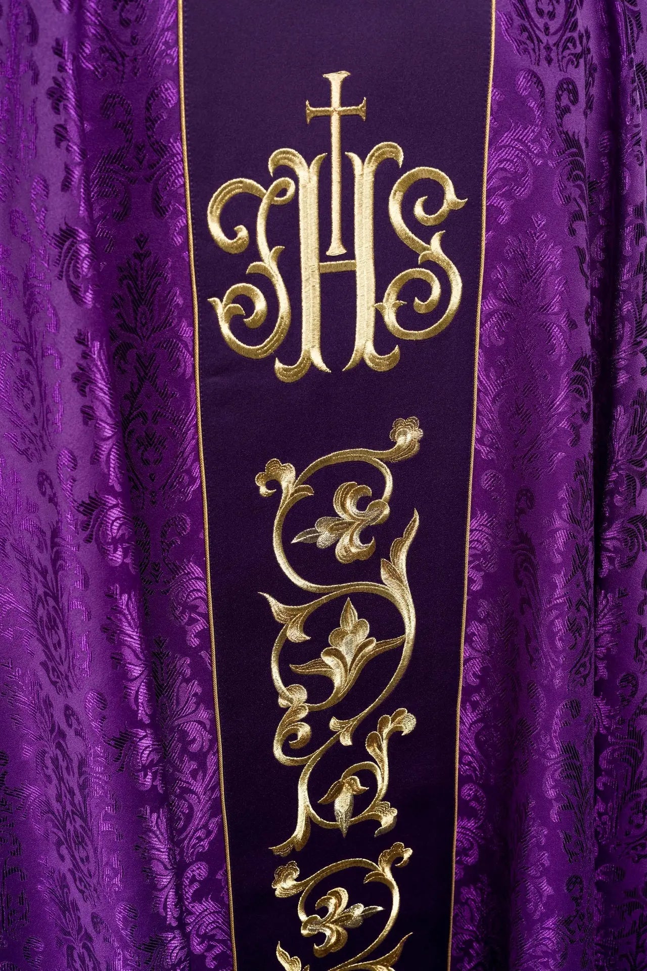 Purple liturgical chasuble with richly decorated IHS belt
