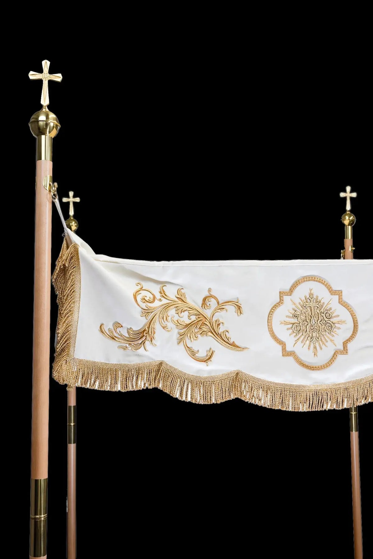 White baldachin with gold embroidery and fringe, side view