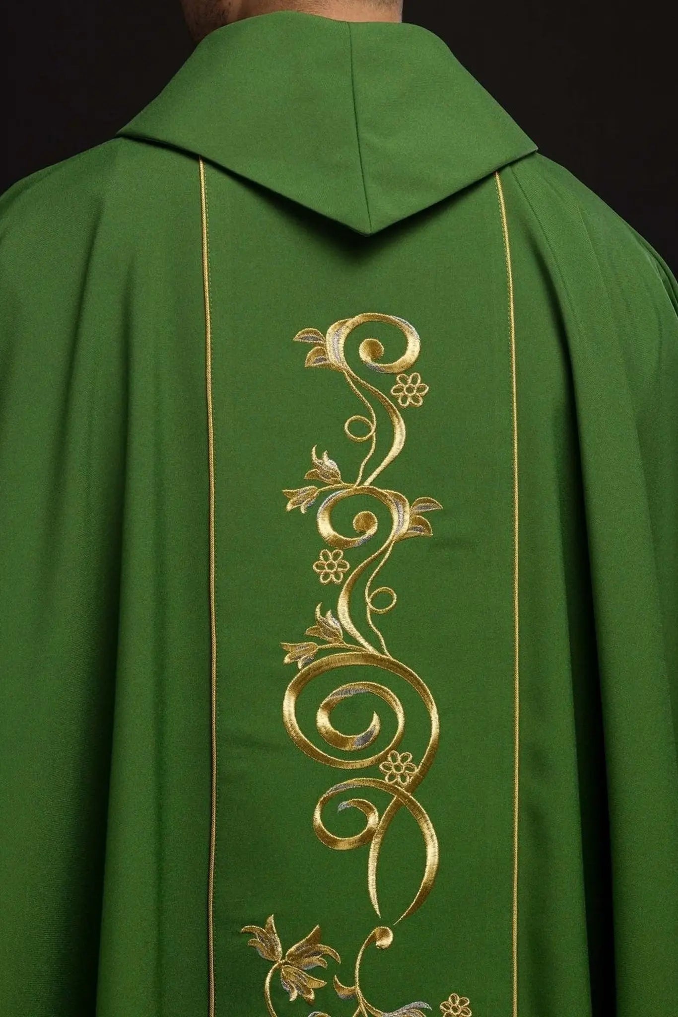 Richly decorated green chasuble with gold motif and wide IHS band