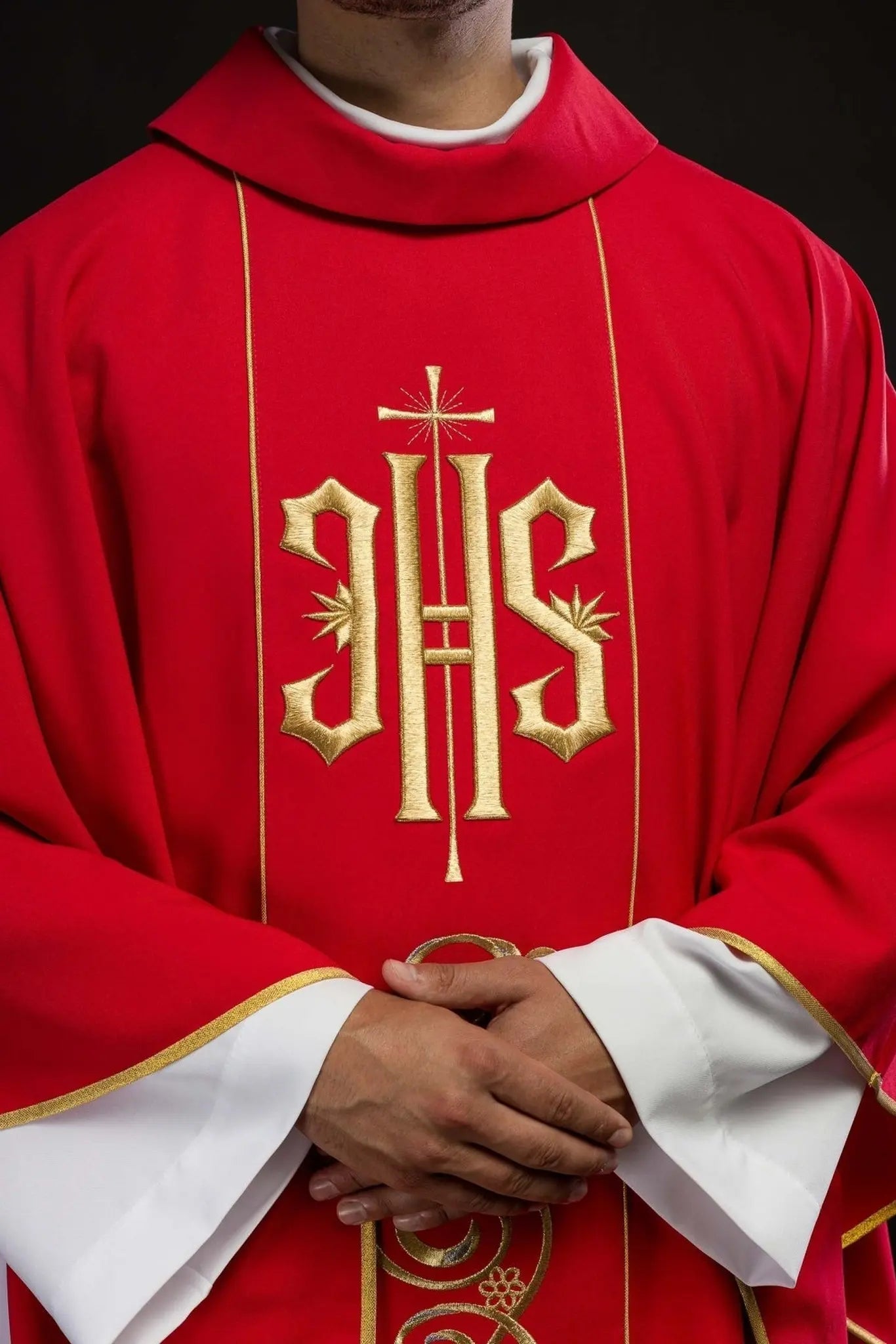 Red chasuble embroidered with IHS
