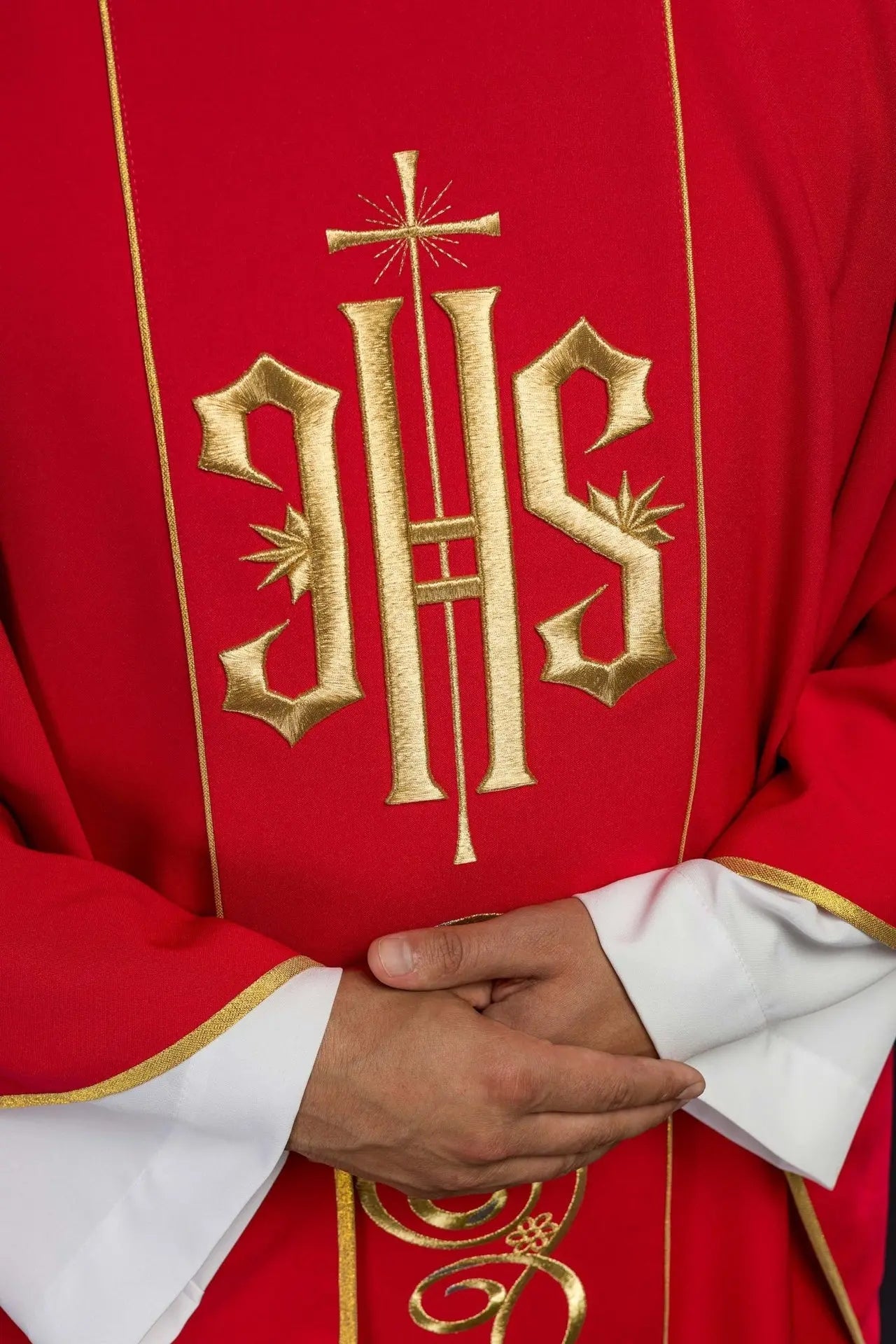 Red chasuble embroidered with IHS
