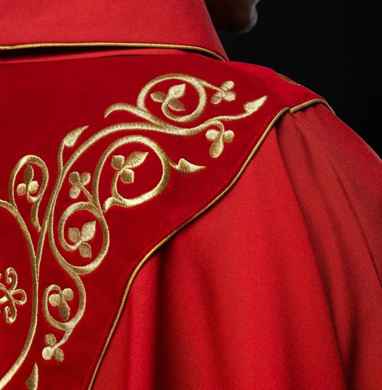 Red liturgical chasuble decorated with embroidery on velvet