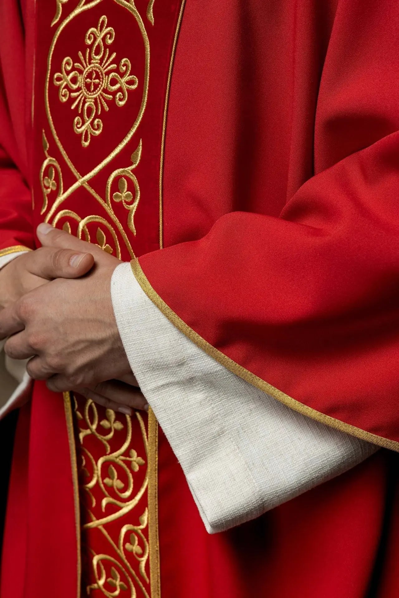 Red liturgical chasuble decorated with embroidery on velvet