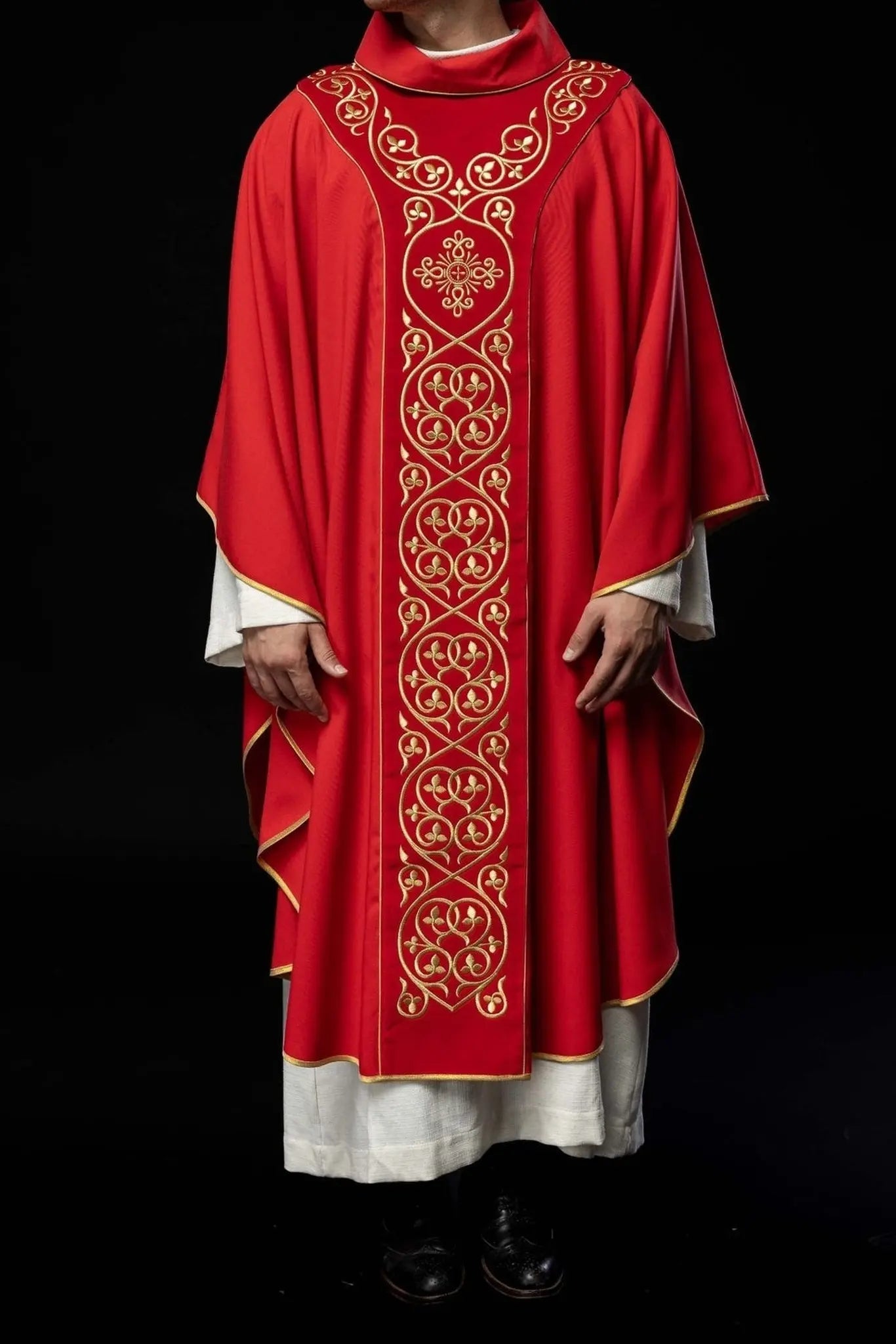 Red liturgical chasuble decorated with embroidery on velvet