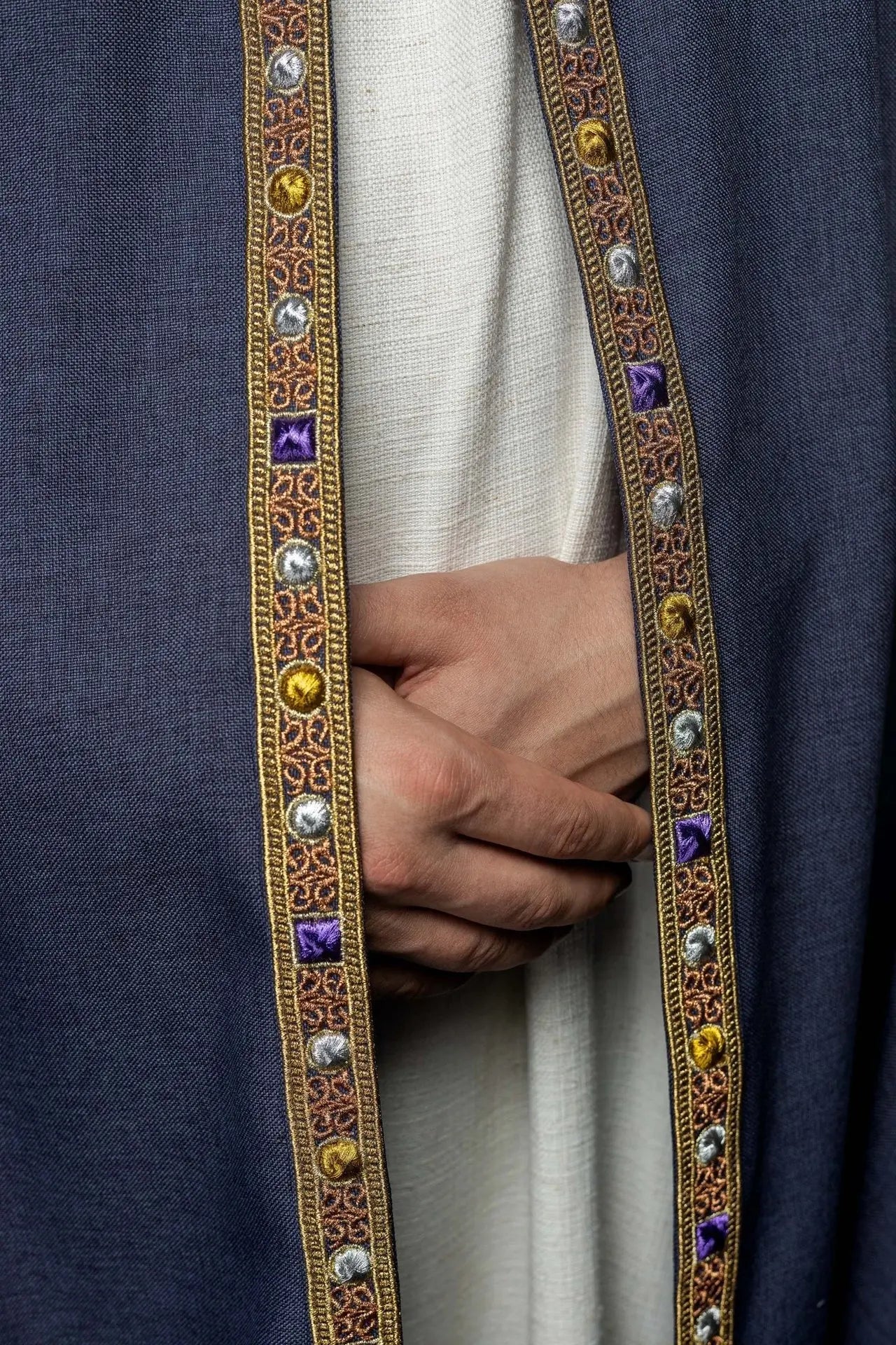 Purple liturgical cape with gold IHS