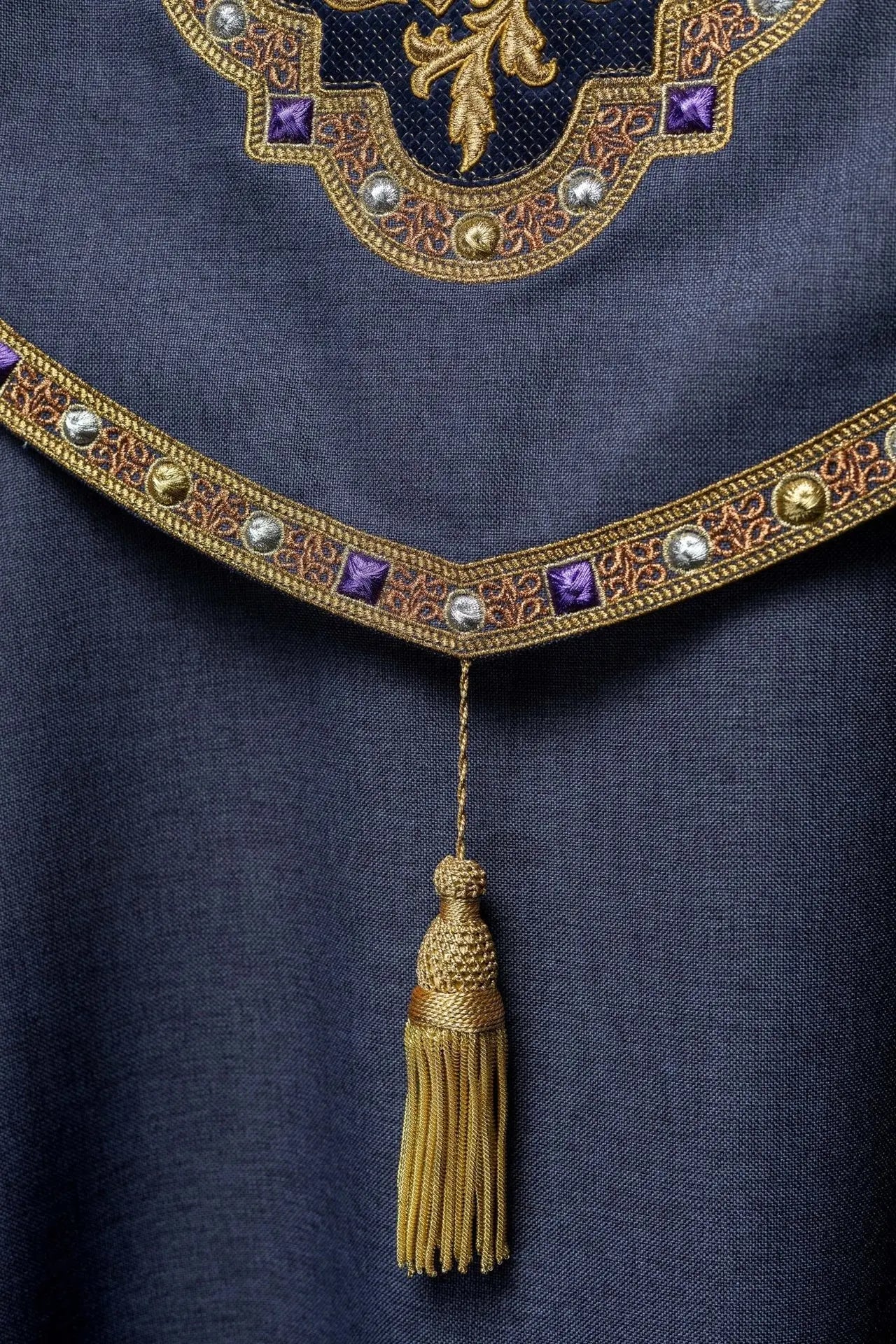 Purple liturgical cape with gold IHS