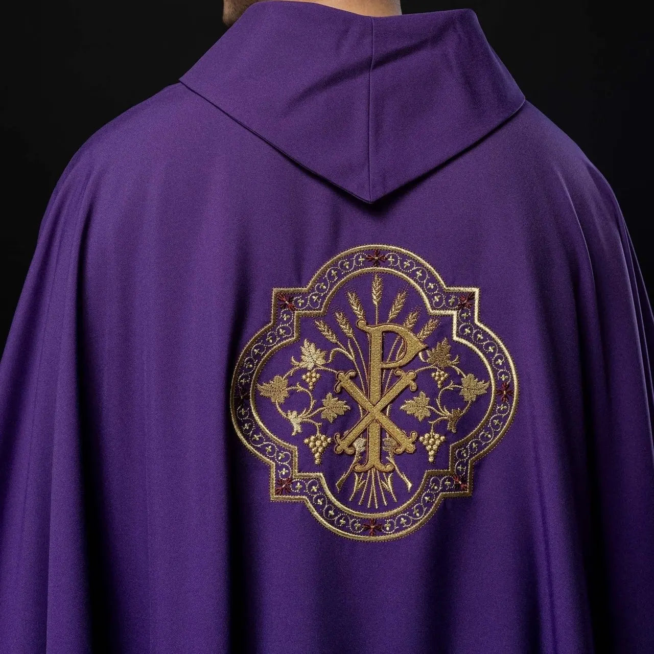 Purple chasuble with IHS and PAX embroidery