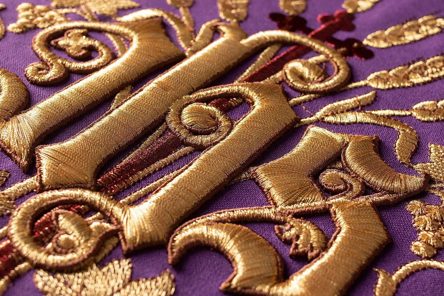 Purple chasuble with IHS and PAX embroidery