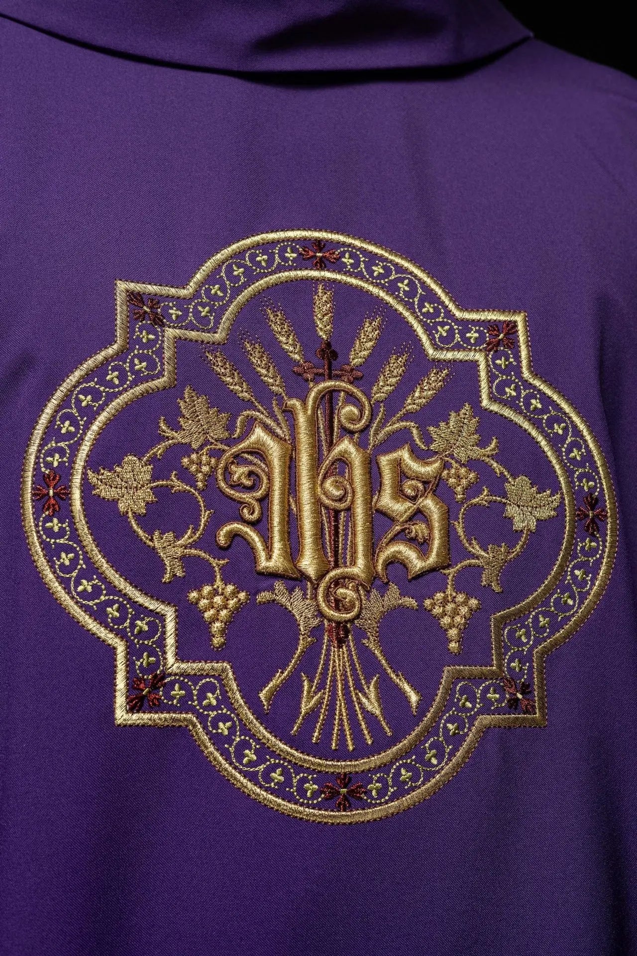Purple chasuble with IHS and PAX embroidery