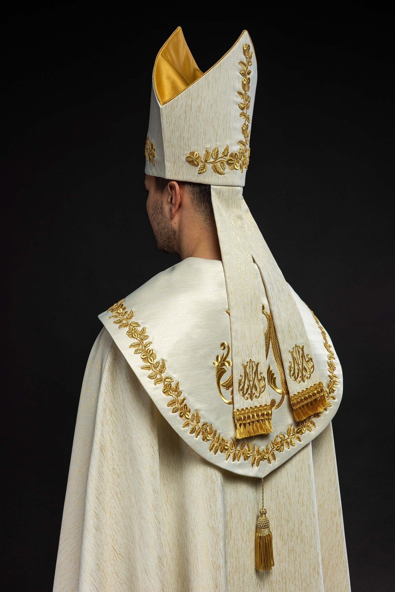 Ecru Marian mitre with rich gold embroidery and floral patterns