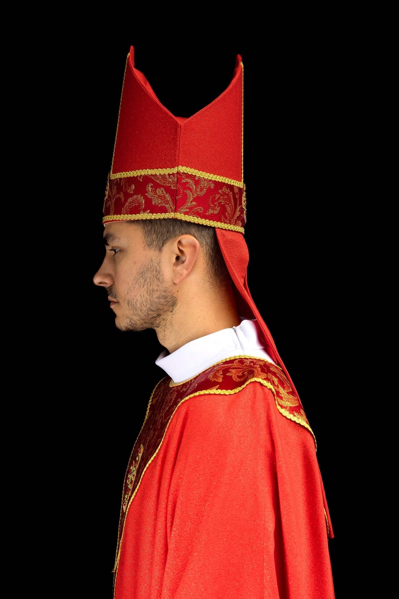 Red embroidered mitre with a cross motif and decorative jacquard fabric