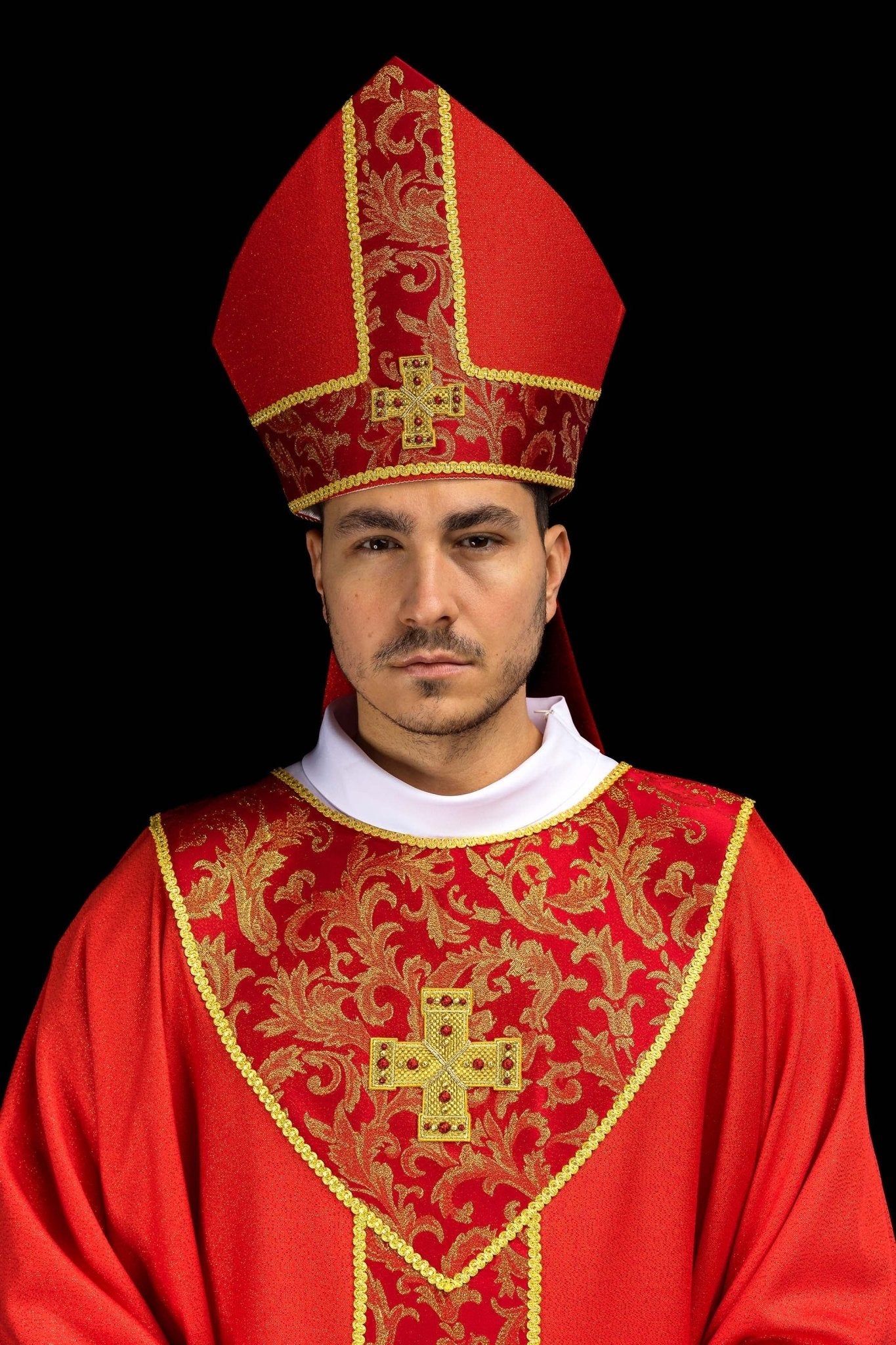 Red embroidered mitre with a cross motif and decorative jacquard fabric