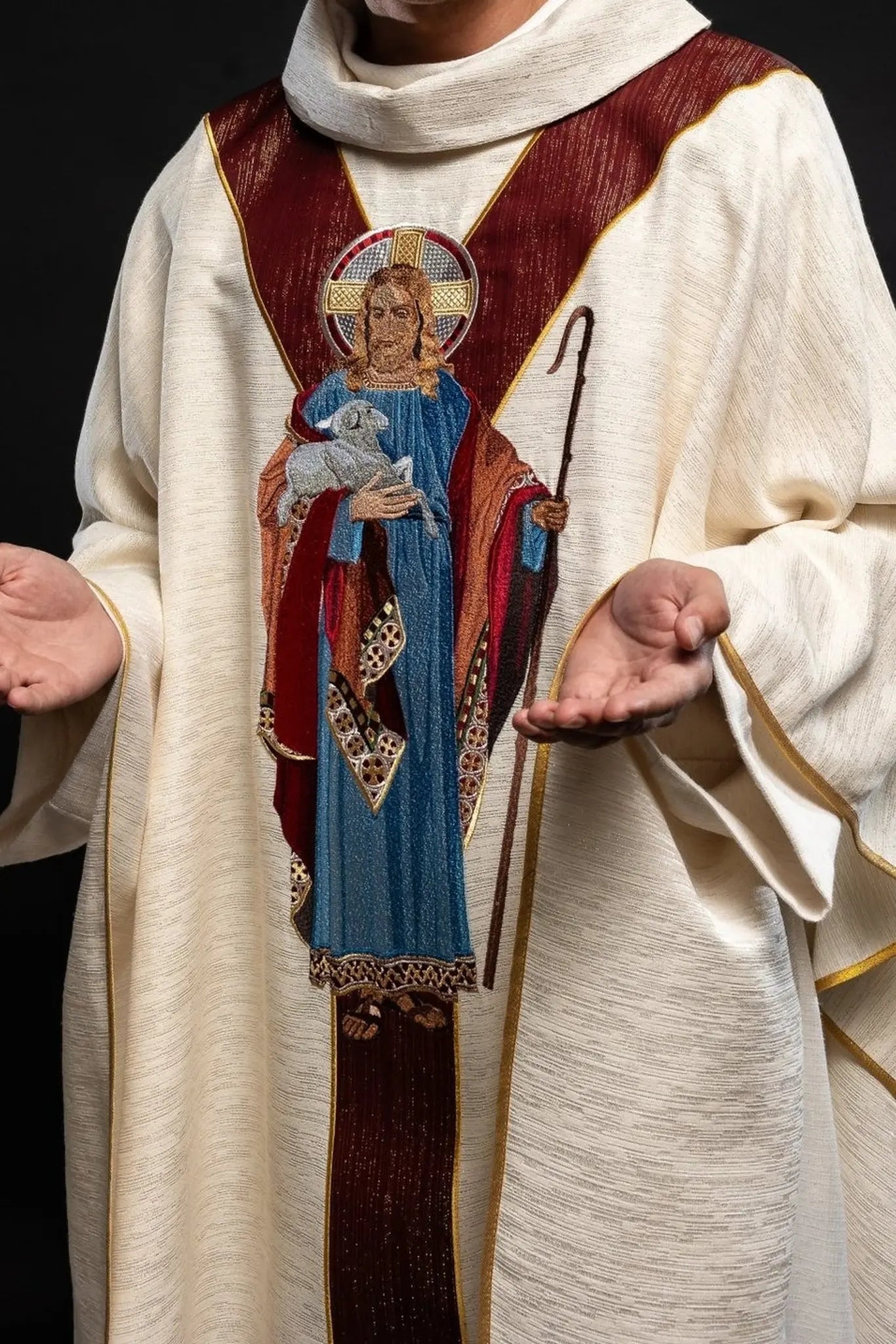 Chasuble ecru with the image of Jesus the Good Shepherd with a decorative burgundy stripe