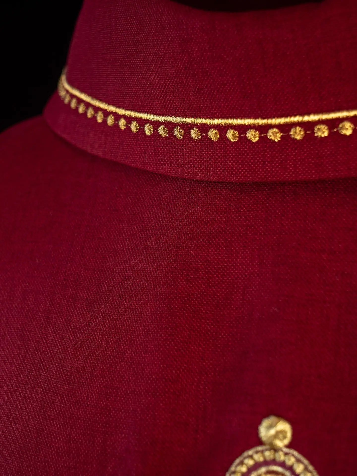 Chasuble with embroidered cross and gold trim on collar in red