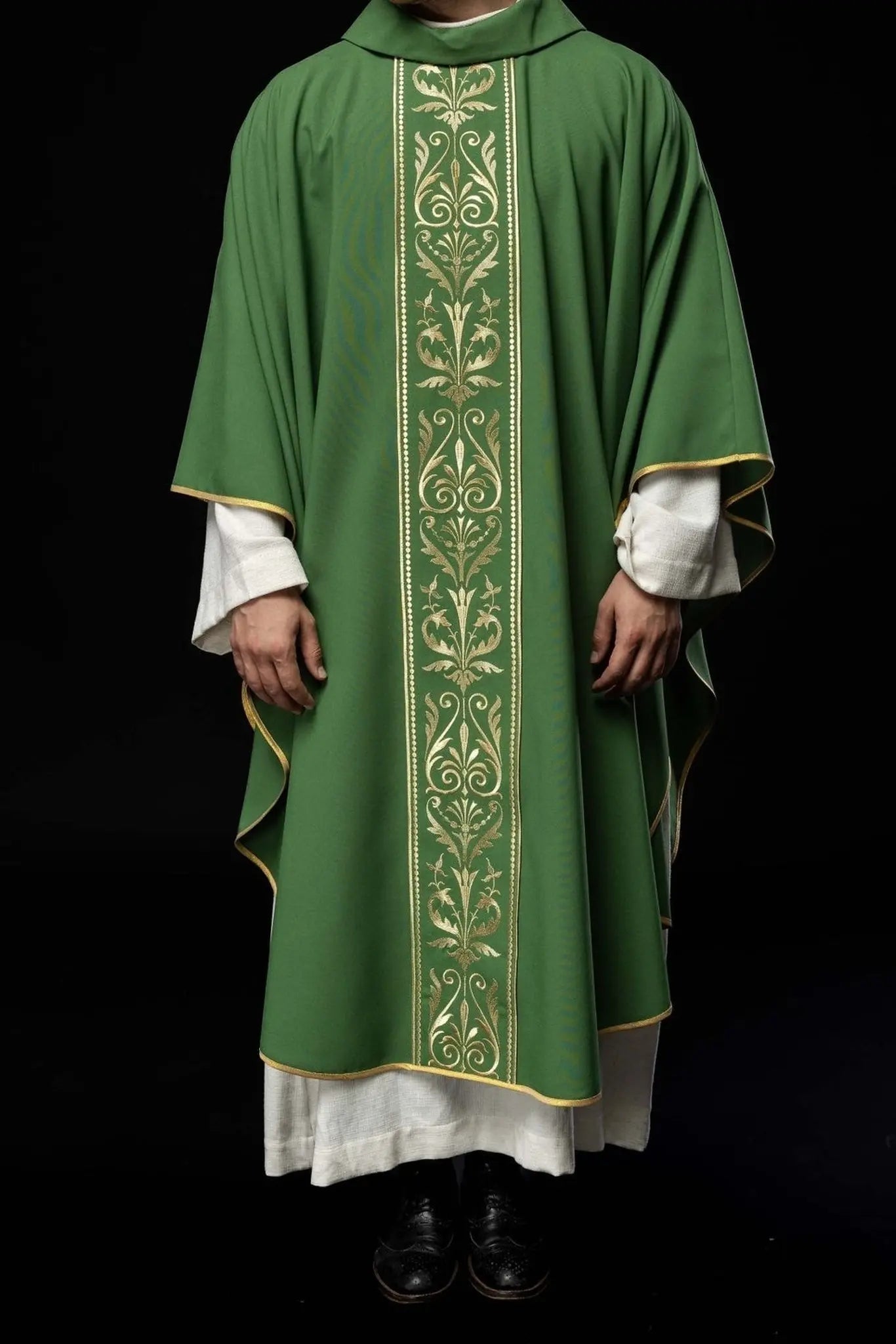 Green liturgical chasuble decorated with gold embroidered belt
